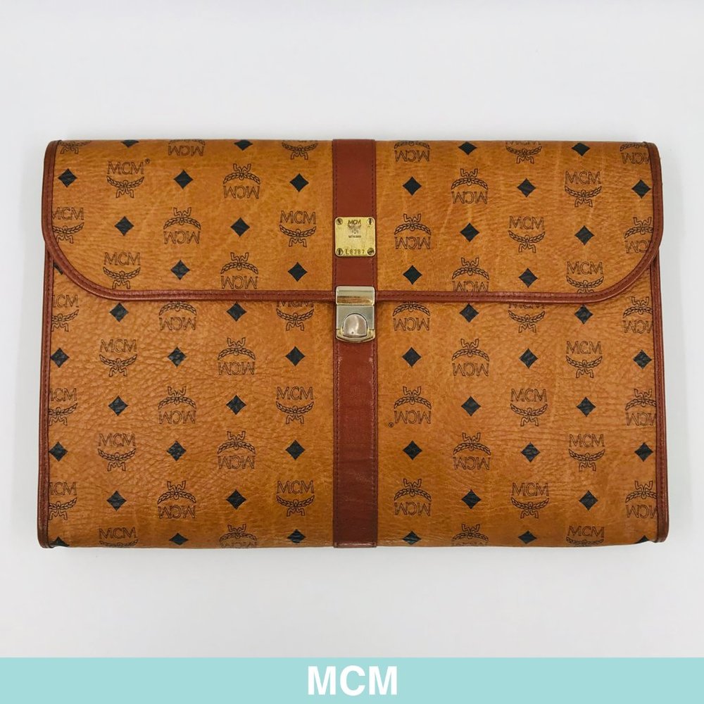 Auth MCM brown leather logo clutch/case